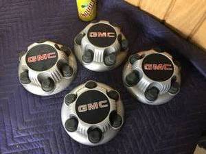 lot 63 image: 4 GMC Plastic Hub Caps