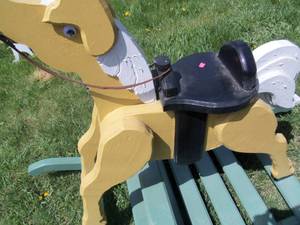 lot 18 image: Yellow wooden Rocking horse...