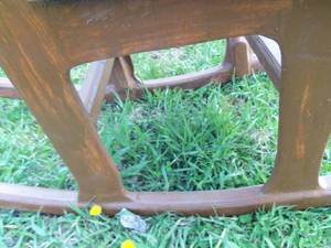 lot 21 image: Brown Wooden Rocking Chair...