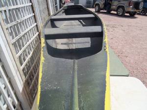 lot 23 image: Yellow Fiberglass Canoe...