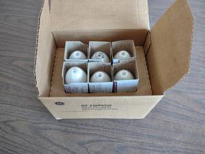 lot 447 image: (6) GE 100 Watt Bulbs...