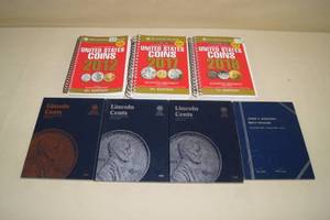 lot 48 image: Empty Coin Storage Folders and Red Value Books