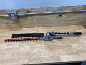 lot 77 image: RYOBI Expand-It 15 in. Articulating Hedge Trimmer Attachment