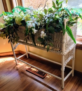 lot 32 image: White Wicker Plant Stand and Faux Floral Arrangement