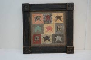 Vintage quilt pieces in frame