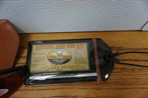lot 87 image: True Blue Poly Carbon UV Sunglasses With Case With Crooked Horn Outfitters License and Horn Tag Kit