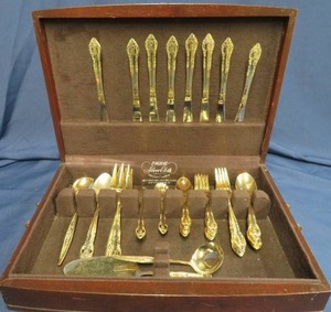 lot 63 image: COMPLETE 8 PLACE SETTING PLUS SERVING UTENSILS. HF STAINLESS LTD. GOLD TONE