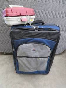 lot 101 image: LARGE SUITCASE AND A TACKLE BOX.