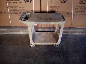 lot 14 image: 38 x 33 x 19 commercial grade plastic Rubbermaid push cart