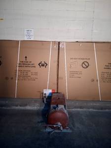 lot 38 image: Heavy duty 20 gallon steel air compressor tank on steel brackets