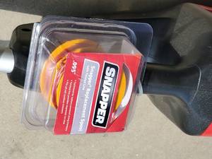 lot 2 image: Brushless 60V MAX Snapper Weed Trimmer with Charging Station