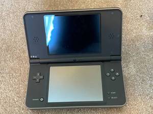 lot 139 image: Nintendo DS XL With Games