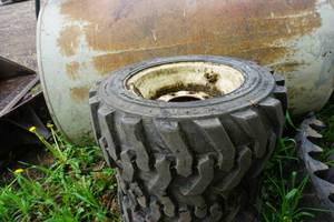 lot 11 image: Set of 4 -  Camso Brand Wide Wall Skid Loader Tires and Rims