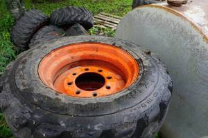 lot 12 image: Set of 4 - Bobcat Skid Loader Skid Steer Tires On 8 Bolt Rims
