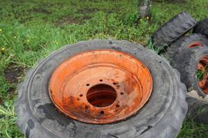 lot 13 image: Set of 4 - Bobcat Skid Loader Skid Steer Tires On 8 Bolt Rims