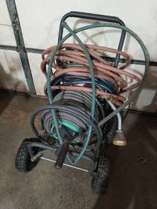 lot 308 image: Hose Catty With Three Hoses