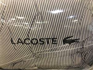 lot 112 image: Lacoste Home Lacoste Meribel Colorblocked King Reversible Comforter Set, NEW