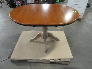 lot 214 image: Black and Cherry 36 in. x 36 in. x 48 in. Extension With Ash Pedestal Table.