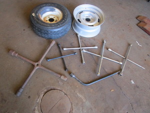 lot 432 image: CLASSIC CHEVY WHEEL, TRAILER TIRE AND LUG WRENCHES