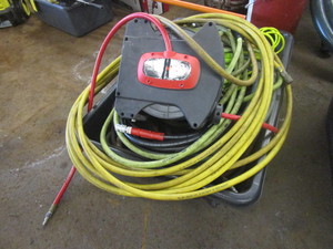lot 486 image: BIN OF AIR HOSE AND A HOSE REEL