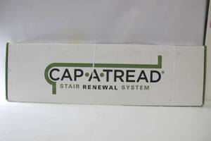 lot 593 image: Cap-A-Tread Auburn Scraped Oak 47 in. Length x 12-18 in. Deep x 1-1116 in. Height Laminate to Cover Stairs 1 in. Thick