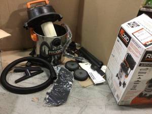 lot 77 image: 16 Gallon 6.5-Peak HP Stainless Steel WetDry Shop Vacuum with Fine Dust Filter, Hose and Accessories by RIDGID (customer return) (see pictures) 
