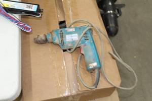 lot 586 image: Makita Hammer Drill Variable Speed 10mm 115-phase HP1030