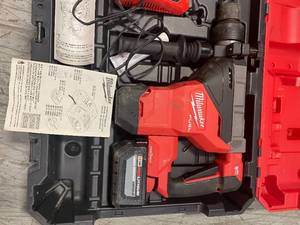 lot 111 image: Milwaukee M18 Rotary Hammer with one key includes battery and Charger Used in working condition Customer Returns See Pictures