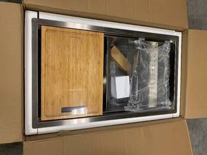 lot 114 image: All-in-One Undermount Stainless Steel 33 in. 5050 Double Bowl Kitchen Workstation Sink with Accessory Kit by Glacier Bay Customer Returns See Pictures