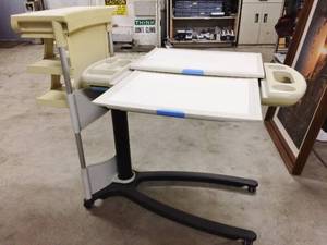 lot 9 image: WOW MSRP $2200 THE CADILLAC IN OVERBED TABLES - HILL-ROM STATE OF THE ART SPLIT TOP OVERBED COMPUTER WORKSTATION MOBILE HILOW TABLE WITH ADDITIONAL AND DETACHABLE SIDE STORAGE SHELVES  GREAT CONDITION