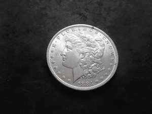 lot 17 image: 1884 O Morgan Silver Dollar