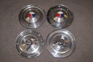 Set of 4 1963 Mercury Hub Caps - 2 with Spinners