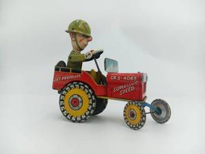 lot 03 image: Vintage 1944 G.I. Joe And His Jouncing Jeep Tin Litho Wind Up Toy With Key