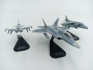 lot 20 image: 3 Altaya Diecast 1100 Scale Aircrafts (1) F-E Tiger II VCF -13 Fighting Saints (1) BAe Harrier GR9A (1) F-22A Raptor