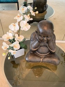 Buddha Figurine and Faux Orchid Plant
