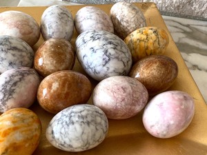 Array of Marble Eggs on Gold Tray