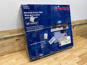 lot 92 image: BOSCH 25-12 in. x 15-78 in. Benchtop Laminated MDF Top Cabinet Style Router Table with 2 Dust Collection Ports