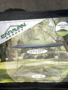 lot 53 image: CARAVAN CANOPY HAVEN SPORTS 12 FT. 7 IN. X 12 FT. 7 IN. FOREST GREENGREY STRAIGHT LEG INSTANT CANOPY. SEE PICTURES