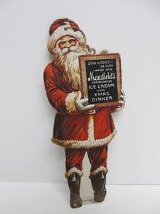 lot 110 image: Antique Mansfields Ice Cream Diecut Cardboard Santa Claus Hanging Display Sign