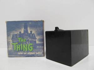 lot 122 image: Working Vintage Addams Family THE THING Electronic Coin Bank