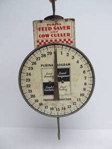 lot 238 image: Old Vintage PURINA Feed Saver & Cow Culler Advertising Farmers Milk Scale
