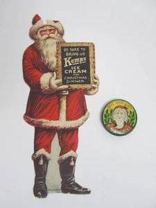 lot 142 image: Orig Antique Diecut KEMPS Ice Cream Santa Hanging Advertisement & Santa Pinback