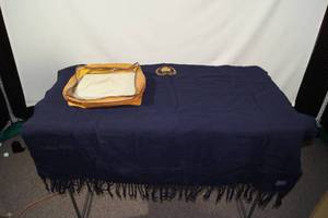 lot 10 image: 1960s Cadillac Back Seat Robe - With Storage Case