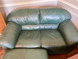 lot 244 image: Green Leather Loveseat and Ottoman