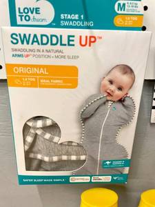 lot 77 image: Lot of Baby Items- Infant Swaddle, Toy and Sunscreen