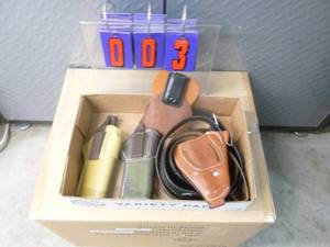 lot 3 image: Flat of holsters. As shown.