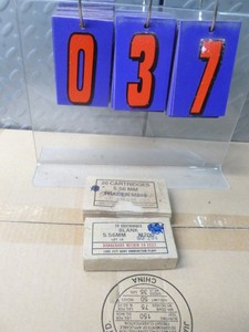 lot 37 image: 2 boxes of 5.56 blank ammo. As shown.