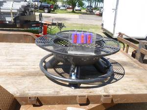 lot 62 image: Large fire pit with swing out grill & shelving. Appears new. AS shown.