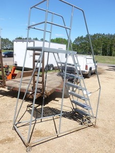 lot 1 image: Cotterman 6 rolling ladder. Good used condition. Just taken out of service. As shown.