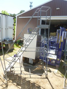 lot 2 image: Cotterman 8 rolling ladder. Good used condition. Just taken out of service. As shown.